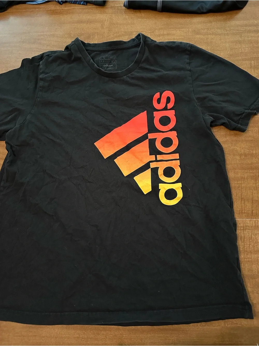 adidas Black Short-Sleeve Tee with Red-Orange-Yellow Gradient Logo